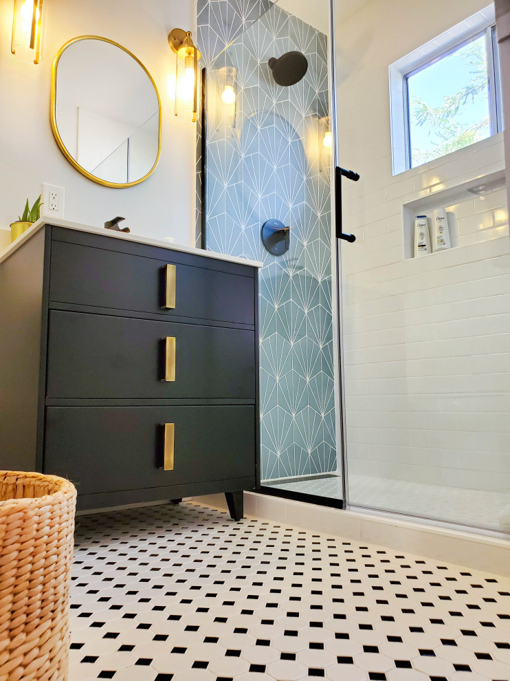This is an example of a small 3/4 bathroom in Phoenix with brown cabinets, an alcove shower, multi-coloured tile, ceramic tile, white walls, ceramic floors, an integrated sink, a hinged shower door, white benchtops, a single vanity and a freestanding vanity.