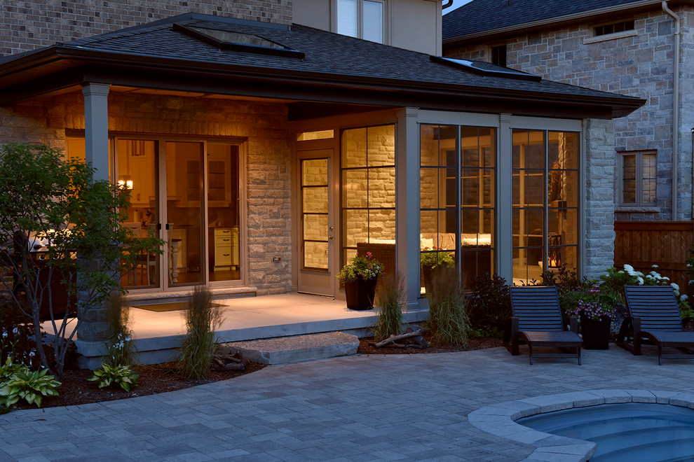 This is an example of a transitional sunroom in Toronto.