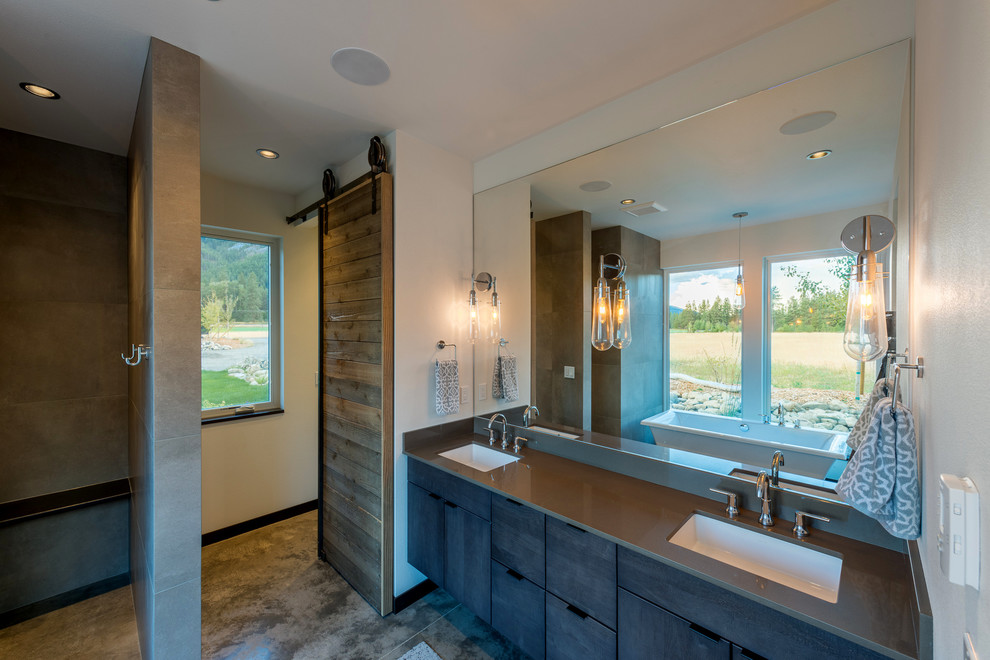 Photo of a large country master bathroom in Seattle with flat-panel cabinets, brown cabinets, an alcove shower, white tile, porcelain tile, white walls, concrete floors, an undermount sink, recycled glass benchtops, beige floor, an open shower and grey benchtops.