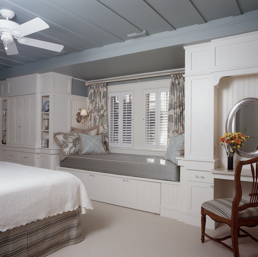 Inspiration for a beach style bedroom in Portland Maine with carpet.