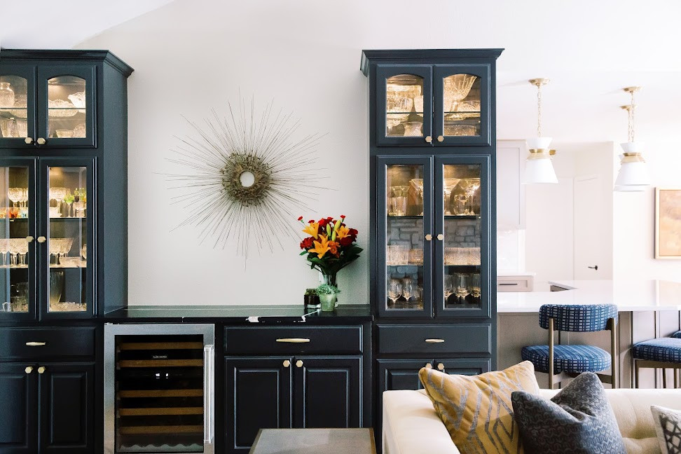 Example of a small transitional single-wall porcelain tile and brown floor dry bar design in Austin with glass-front cabinets, blue cabinets, quartz countertops, black countertops and no sink