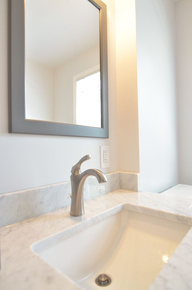 Inspiration for a mid-sized transitional master gray tile and ceramic tile ceramic tile alcove shower remodel in Philadelphia with an undermount sink, shaker cabinets, gray cabinets, marble countertops, a two-piece toilet and white walls