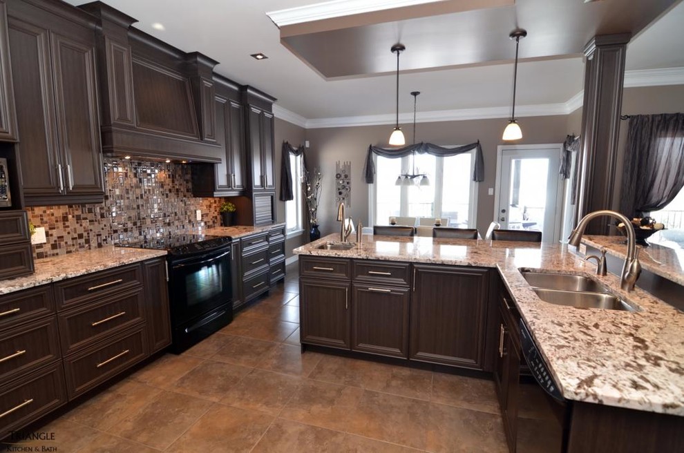 Example of a large transitional u-shaped eat-in kitchen design in Ottawa with granite countertops, black appliances, an island, a double-bowl sink, recessed-panel cabinets, dark wood cabinets, multicolored backsplash and glass tile backsplash