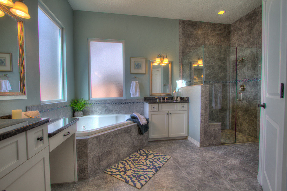 Large traditional master bathroom in Albuquerque with an undermount sink, shaker cabinets, white cabinets, granite benchtops, a corner tub, a curbless shower, a two-piece toilet, gray tile, porcelain tile, blue walls and porcelain floors.