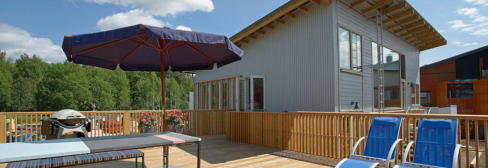 Imagen de terraza campestre grande en azotea con brasero y toldo