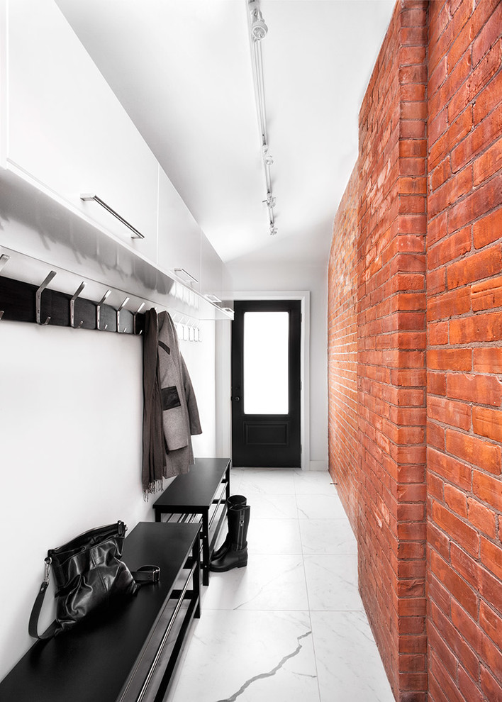 Photo of an industrial entryway in Toronto with white walls and a single front door.