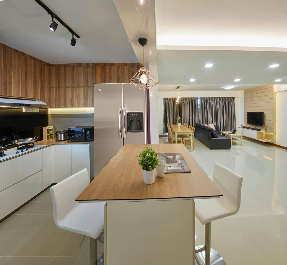 Photo of a mid-sized contemporary kitchen/dining combo in Singapore with white walls and ceramic floors.