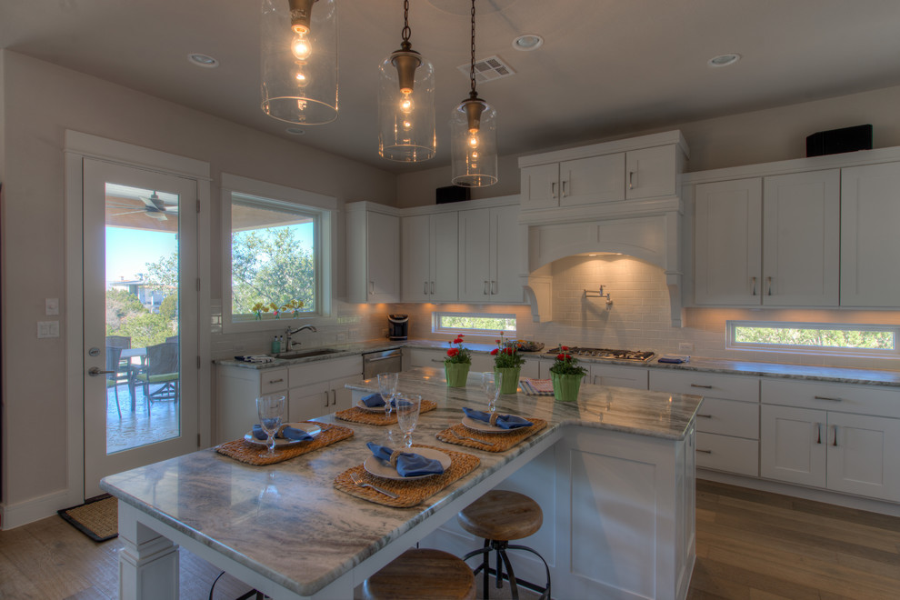 Inspiration for a transitional eat-in kitchen remodel in Austin with an island
