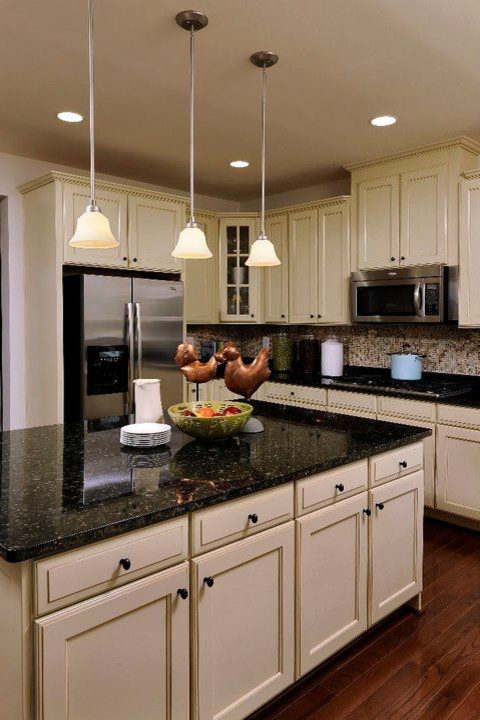 Eat-in kitchen - large transitional u-shaped dark wood floor eat-in kitchen idea in Toronto with shaker cabinets, beige cabinets, granite countertops, multicolored backsplash, mosaic tile backsplash, stainless steel appliances and an island