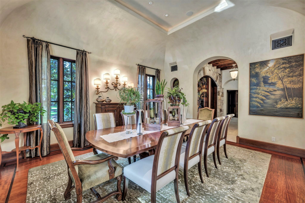 Inspiration for a medium sized mediterranean enclosed dining room in Austin with carpet and green floors.