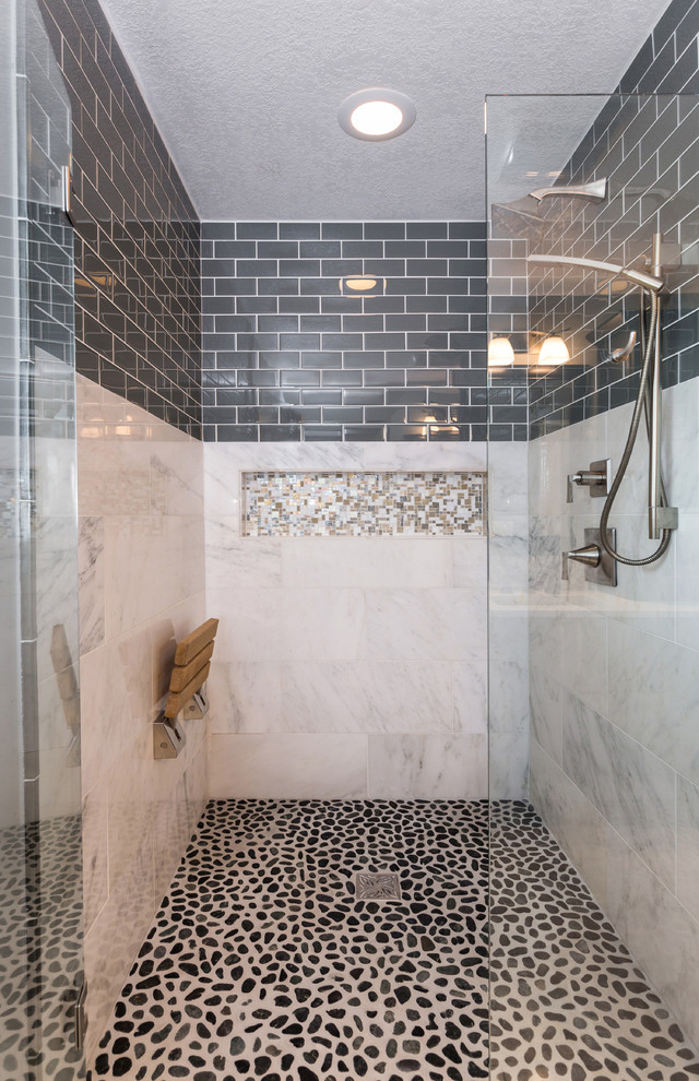 Design ideas for a mid-sized transitional master bathroom in Other with an undermount sink, recessed-panel cabinets, dark wood cabinets, quartzite benchtops, a curbless shower, a one-piece toilet, gray tile, mosaic tile, grey walls and marble floors.