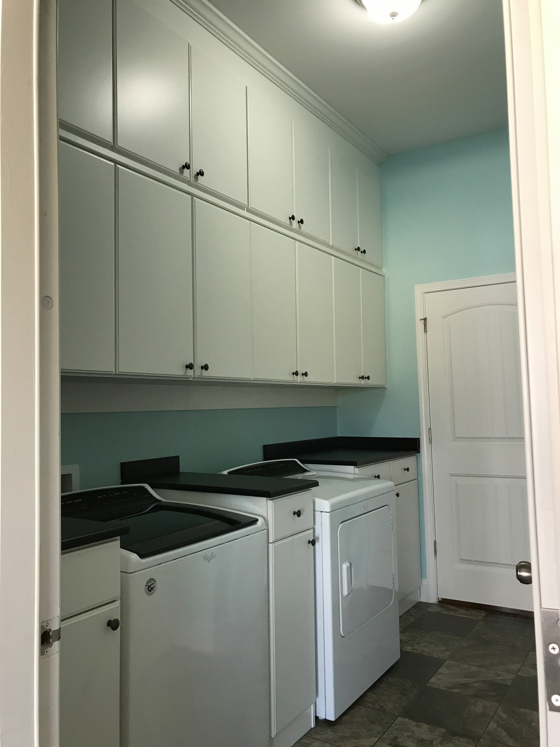 Laundry Room with Wall-Hung Cabinets and Counter Space
