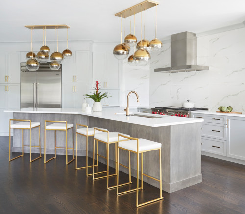 Modern Canadian kitchen with premium RTA cabinets, featuring gray island, gold fixtures, and marble backsplash for a luxurious look.