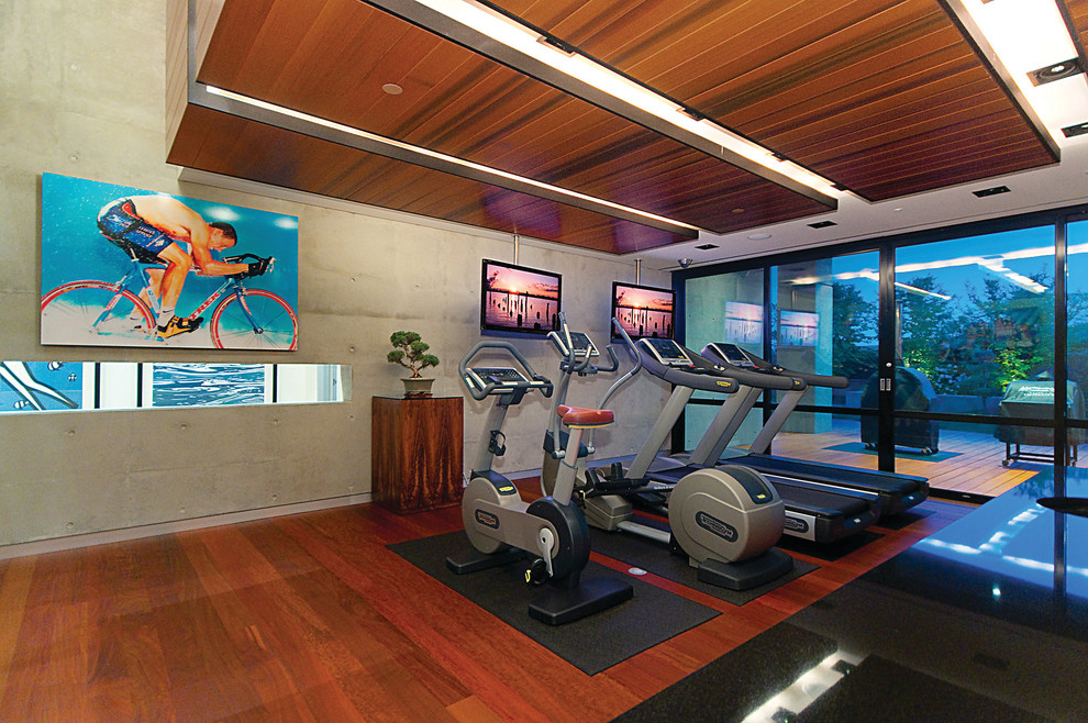 Large contemporary multipurpose gym in Vancouver with medium hardwood floors.