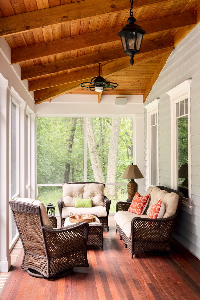 Mid-sized country back porch photo in Milwaukee with decking and a roof extension