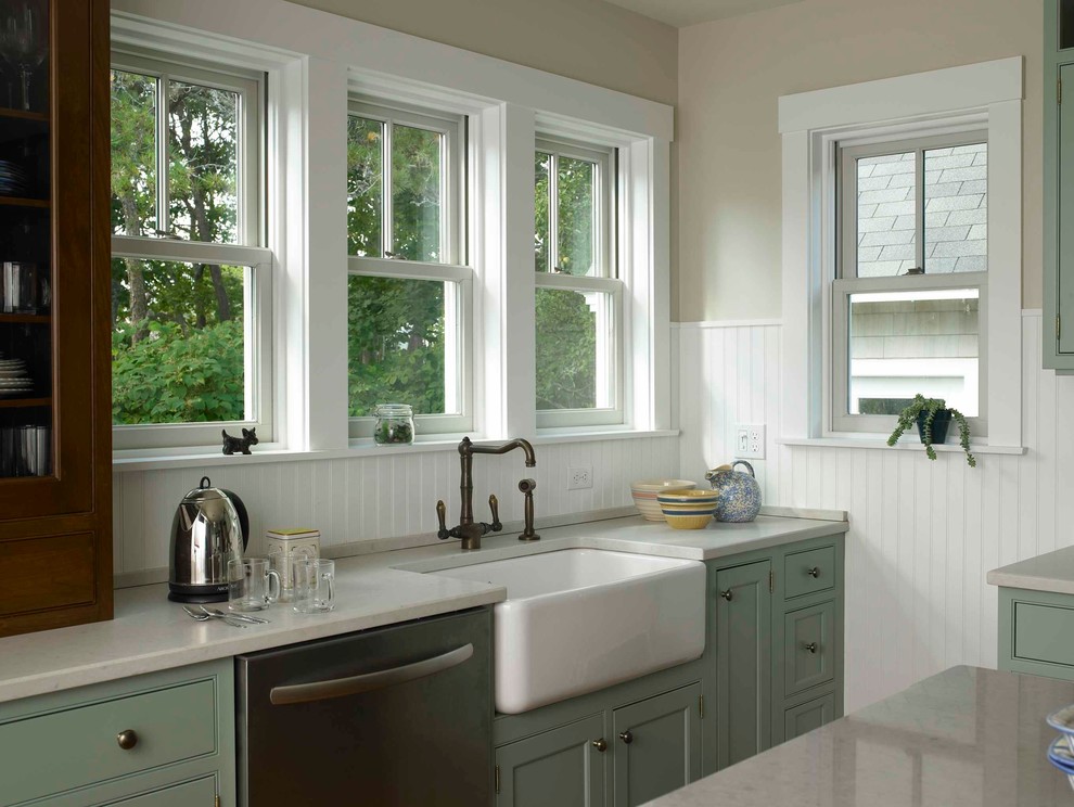 Beach style kitchen in Portland Maine with green cabinets.