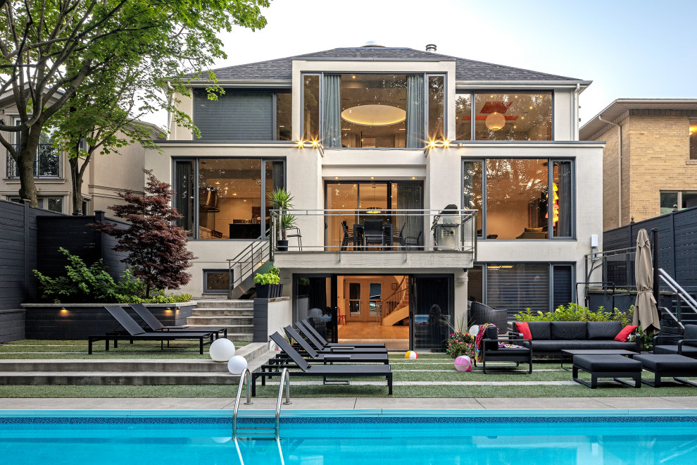 Contemporary white three-story house exterior idea in Toronto with a hip roof, a shingle roof and a gray roof