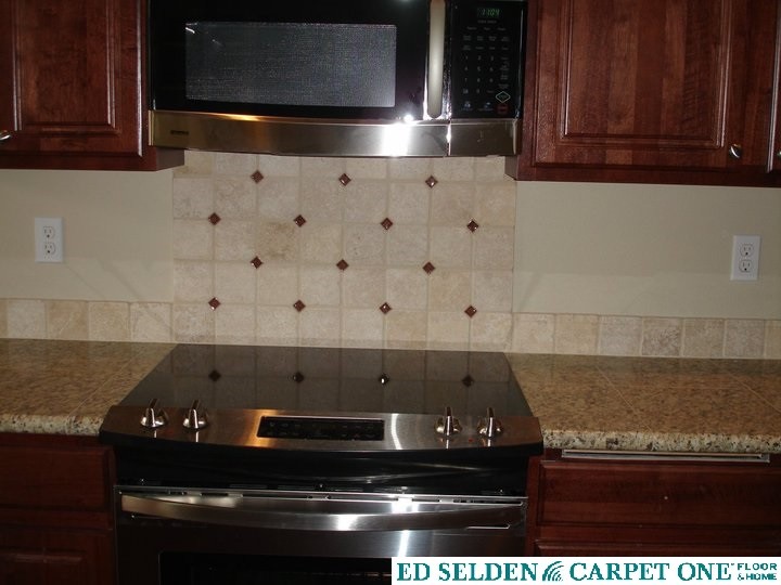 Transitional kitchen photo in Seattle with dark wood cabinets, granite countertops, beige backsplash, stone tile backsplash, stainless steel appliances, beige walls and raised-panel cabinets