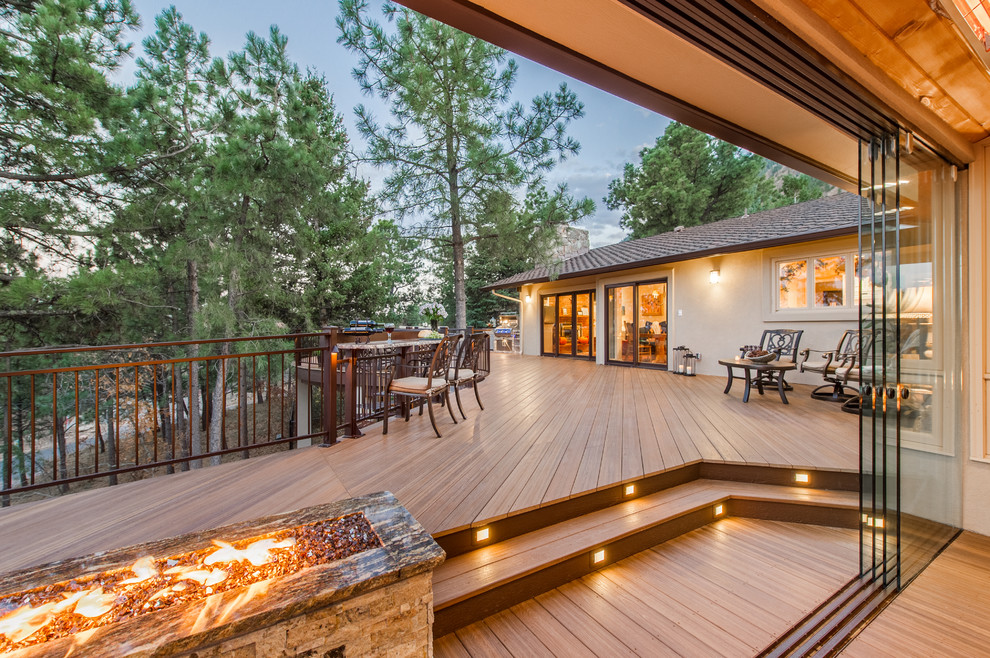 Design ideas for a large contemporary backyard and first floor deck in Other with a fire feature and no cover.