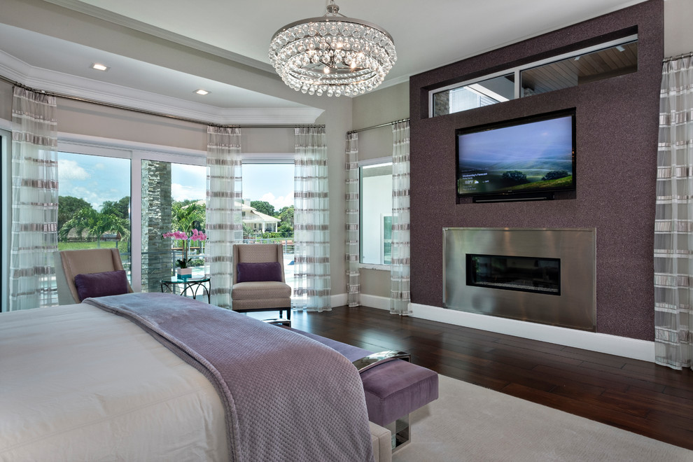 Contemporary master bedroom in Miami with brown walls, dark hardwood floors and brown floor.