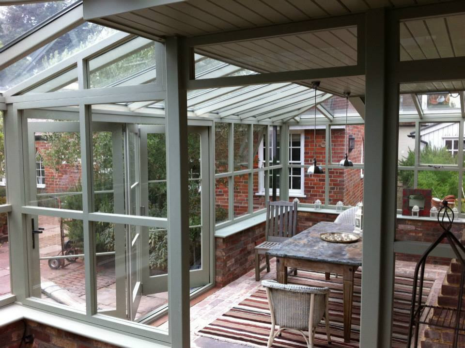This is an example of a traditional sunroom in Hampshire.