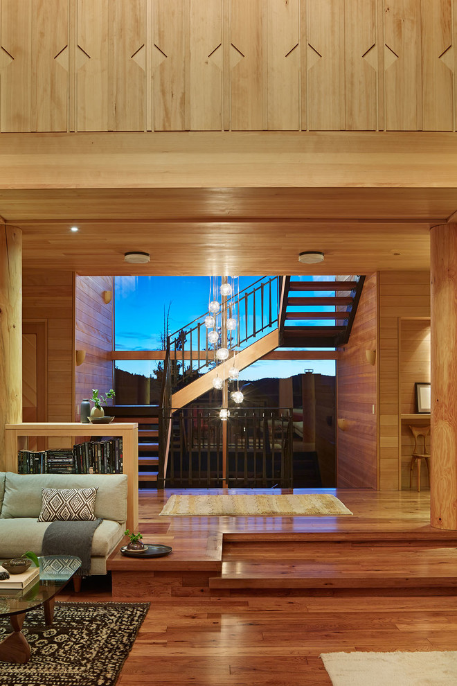 This is an example of an expansive country wood u-shaped staircase in San Francisco.