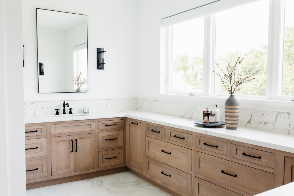 Inspiration for a huge coastal master white tile and ceramic tile marble floor, white floor and double-sink bathroom remodel in Miami with light wood cabinets, white walls, a drop-in sink, quartz countertops, a hinged shower door, white countertops, a niche and a built-in vanity