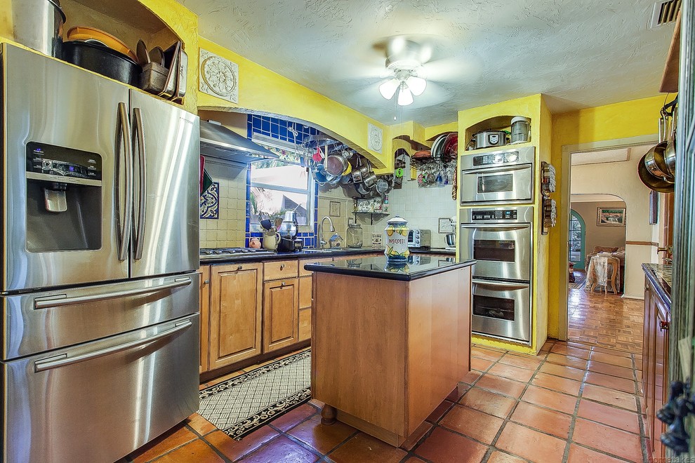 This is an example of a small midcentury kitchen in Miami.
