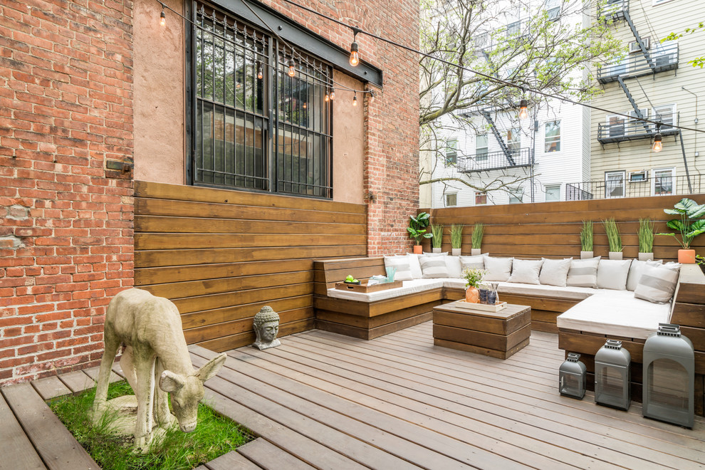 Inspiration for a mid-sized eclectic backyard deck in New York with no cover.