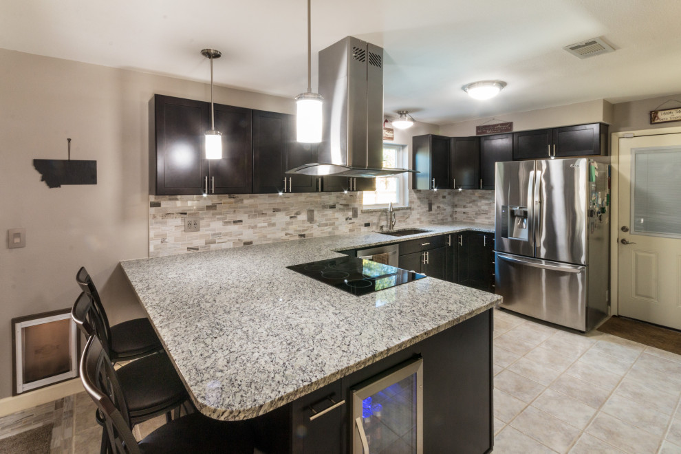 Eat-in kitchen - mid-sized u-shaped ceramic tile and beige floor eat-in kitchen idea with an undermount sink, shaker cabinets, black cabinets, granite countertops, glass tile backsplash, stainless steel appliances, an island and white countertops