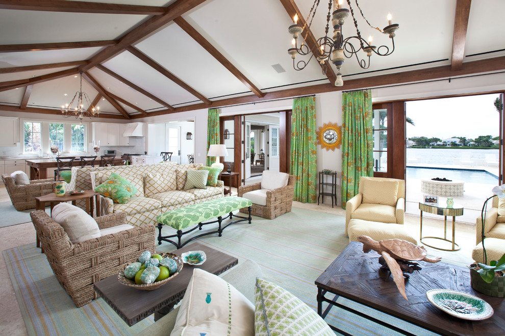 Island style open concept living room photo in Miami with white walls