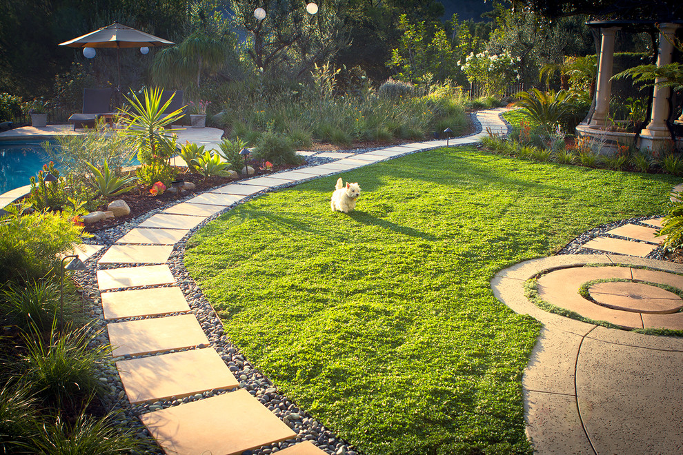 Inspiration for a large contemporary drought-tolerant backyard concrete paver garden path in Los Angeles.
