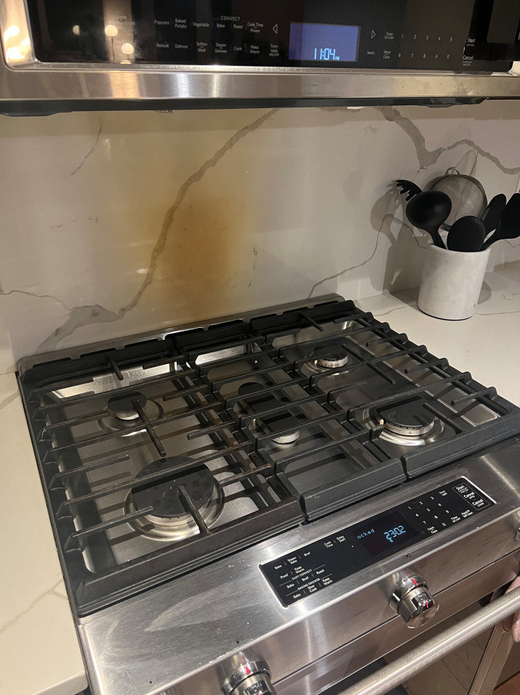 Quartz backsplash burned by oven