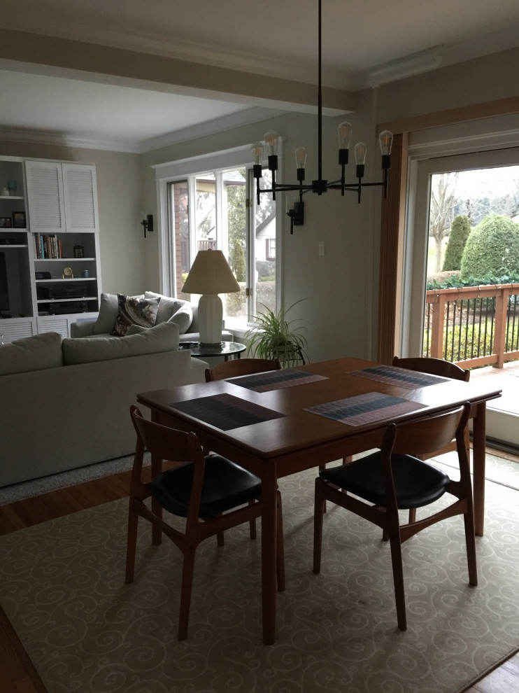 Small 1950s light wood floor and multicolored floor dining room photo with beige walls and no fireplace