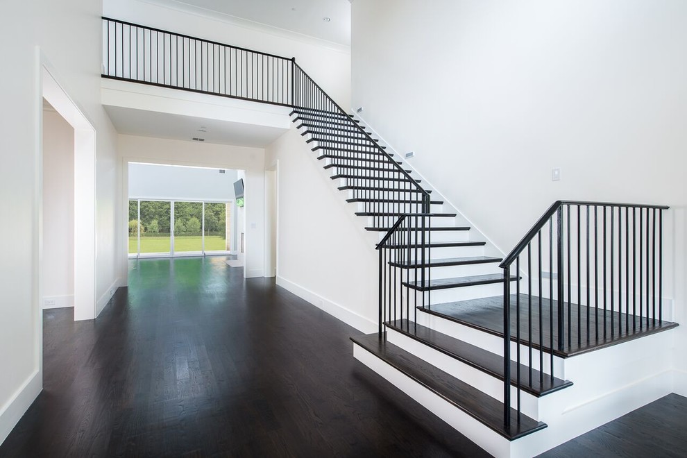 Design ideas for a large contemporary wood l-shaped staircase in Dallas with painted wood risers.