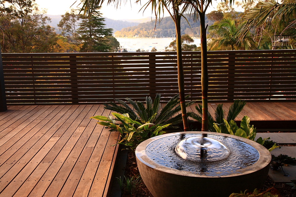 Design ideas for a large tropical balcony in Sydney with no cover.