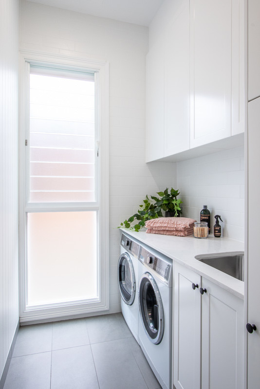 Design ideas for a contemporary laundry room in Sydney.