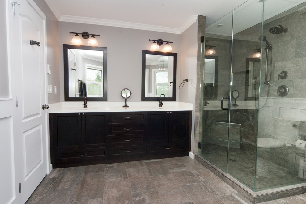 Photo of a large country master bathroom in Vancouver with shaker cabinets, dark wood cabinets, a claw-foot tub, a double shower, a two-piece toilet, brown tile, porcelain tile, purple walls, porcelain floors, an undermount sink and engineered quartz benchtops.