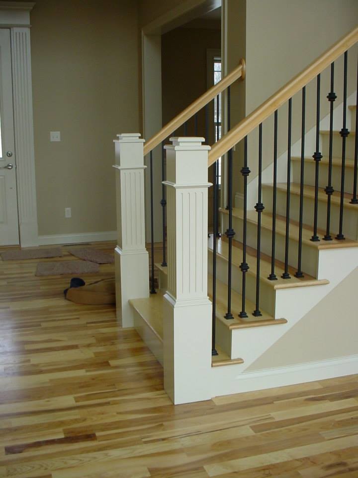 Example of a painted straight staircase design with wooden risers