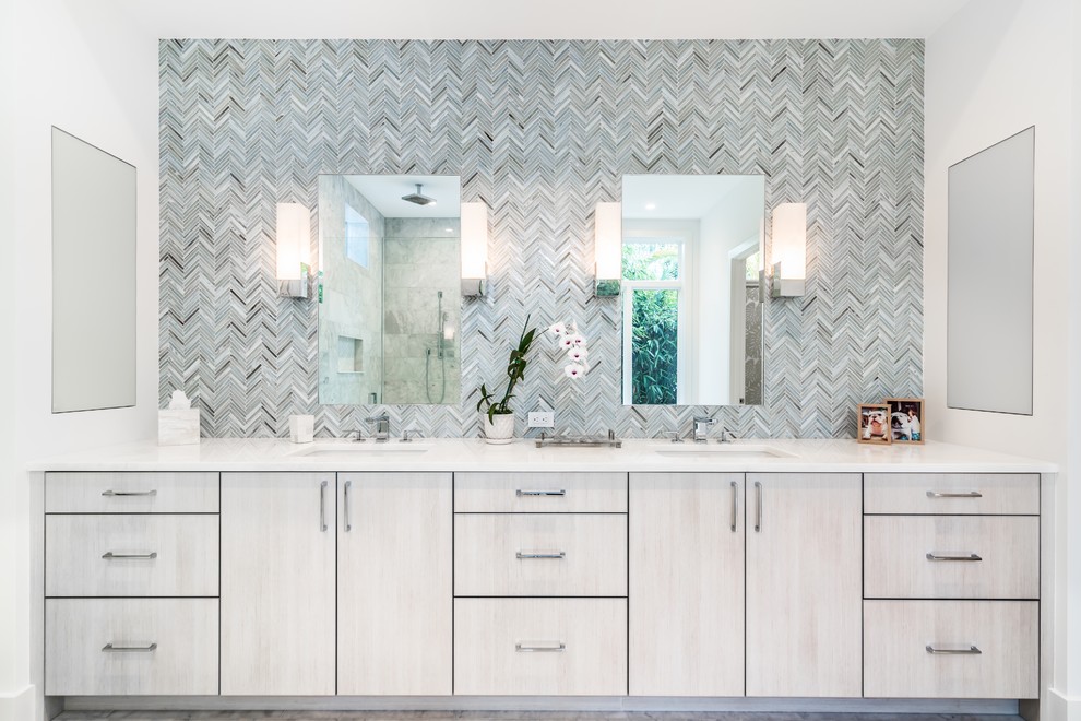 This is an example of a transitional master bathroom in Miami with flat-panel cabinets, light wood cabinets, multi-coloured tile and an undermount sink.