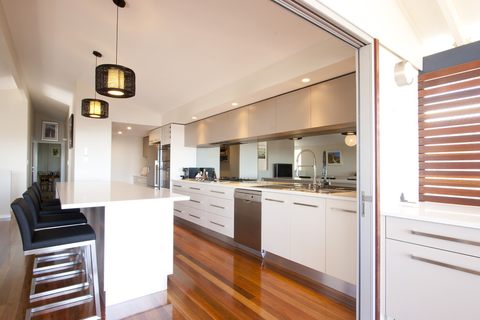 Contemporary single-wall kitchen in Brisbane with stainless steel appliances.