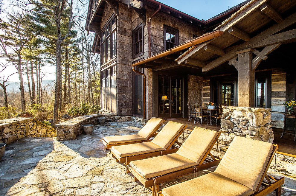 Inspiration for a large rustic backyard deck remodel with no cover