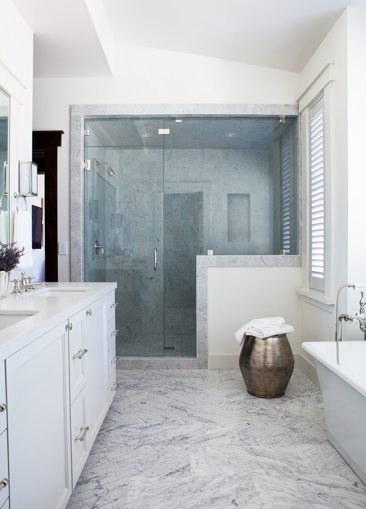 Photo of a transitional bathroom in San Francisco with an alcove shower and marble floors.