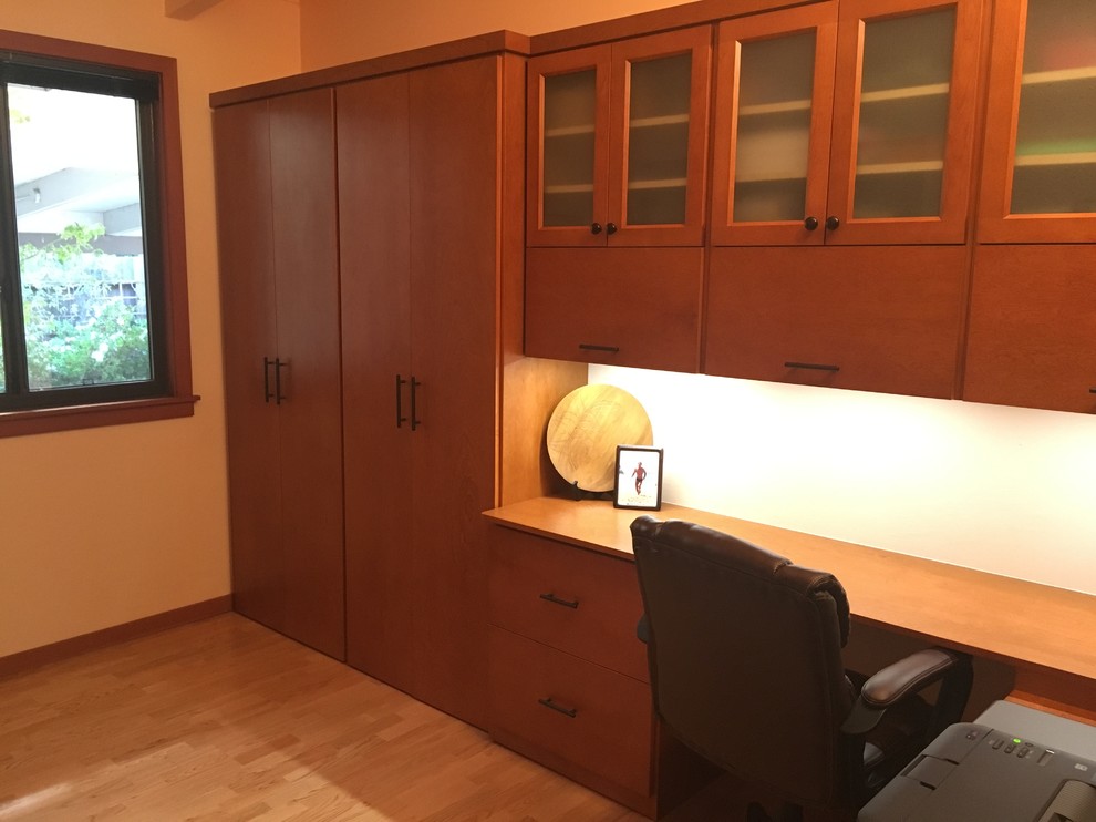 This is an example of a contemporary study room in San Francisco with a built-in desk.