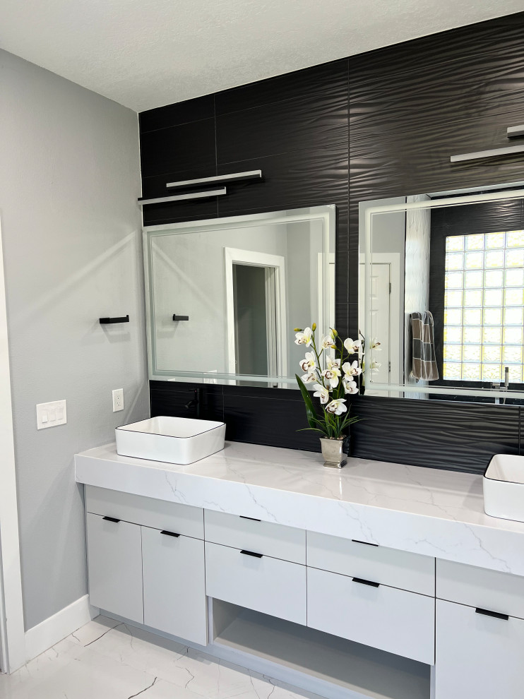 Bathroom - mid-sized contemporary master black tile and ceramic tile porcelain tile, white floor and double-sink bathroom idea in Orlando with flat-panel cabinets, gray cabinets, gray walls, a vessel sink, quartz countertops, white countertops and a built-in vanity