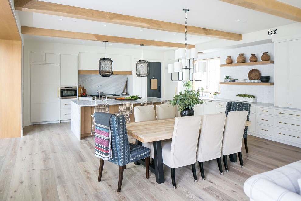 Beach style kitchen/dining combo in Orange County with white walls.