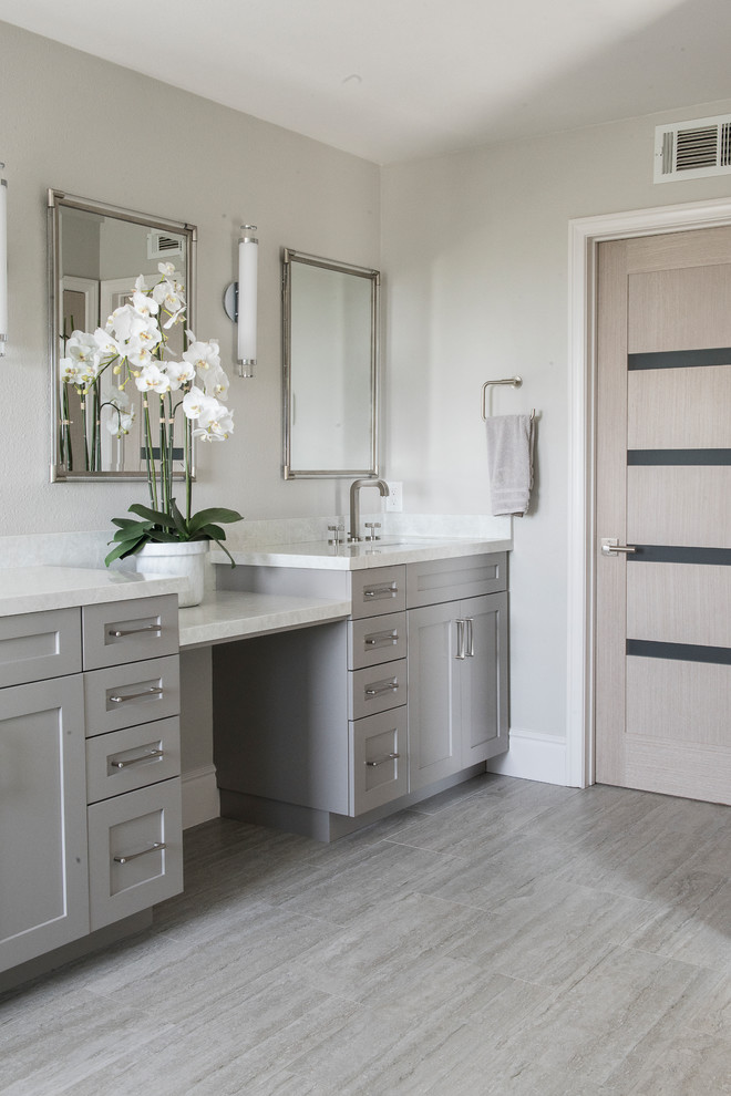 This is an example of a small contemporary master bathroom with shaker cabinets, grey cabinets, light hardwood floors and grey floor.