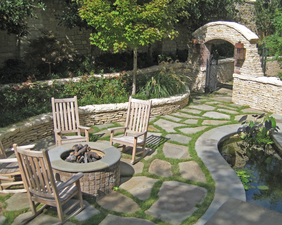 Traditional patio in Dallas with a fire feature.