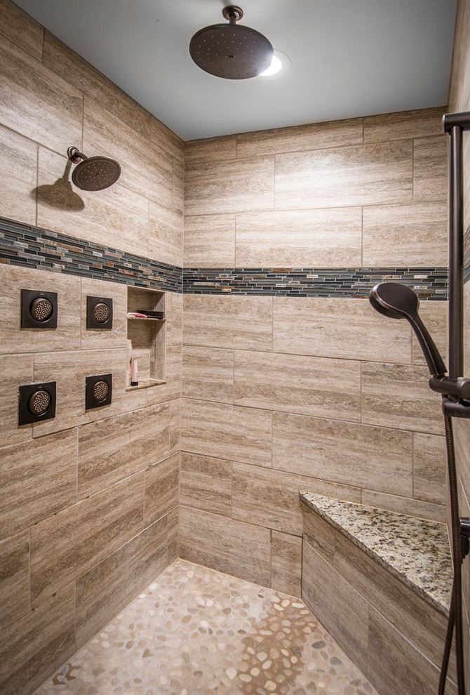 Inspiration for a large transitional master bathroom in Omaha with an undermount sink, shaker cabinets, dark wood cabinets, granite benchtops, a drop-in tub, a curbless shower, beige tile, ceramic tile, beige walls, ceramic floors, a one-piece toilet, grey floor and an open shower.