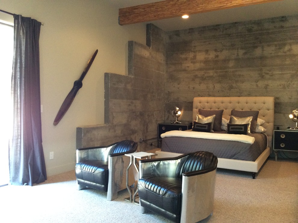 Inspiration for a large industrial master bedroom in San Luis Obispo with white walls and carpet.